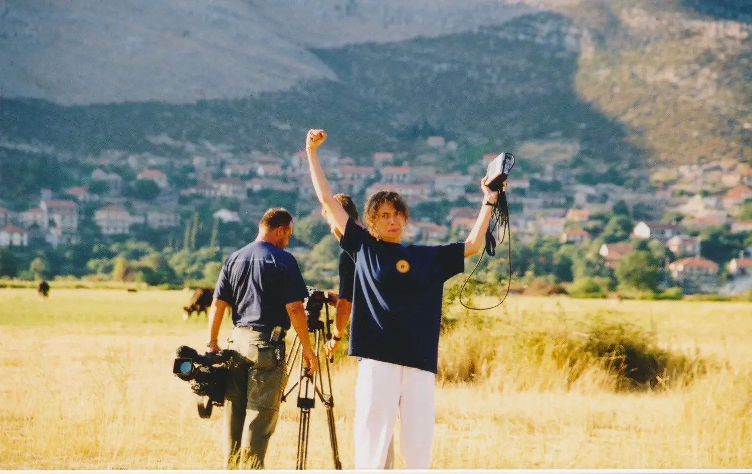 Daphna celebrating in a field in Bosnia with the crew