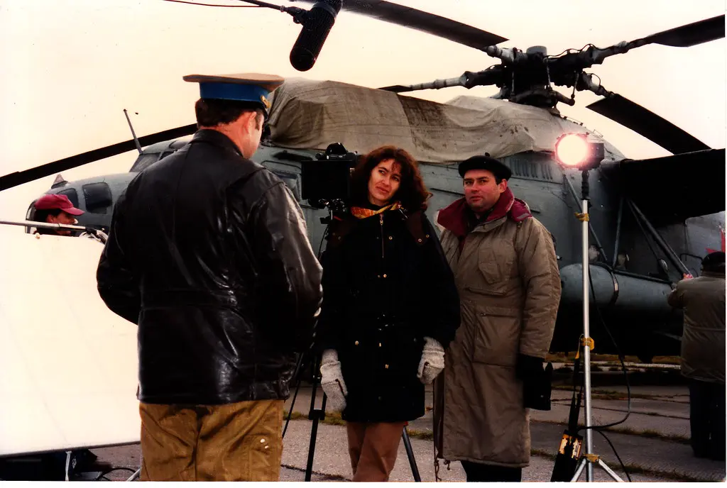 Interviewing a Russian officer near a military helicopter