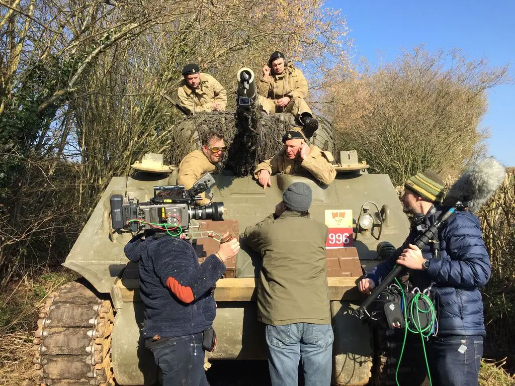 Filming actors on a WWII tank